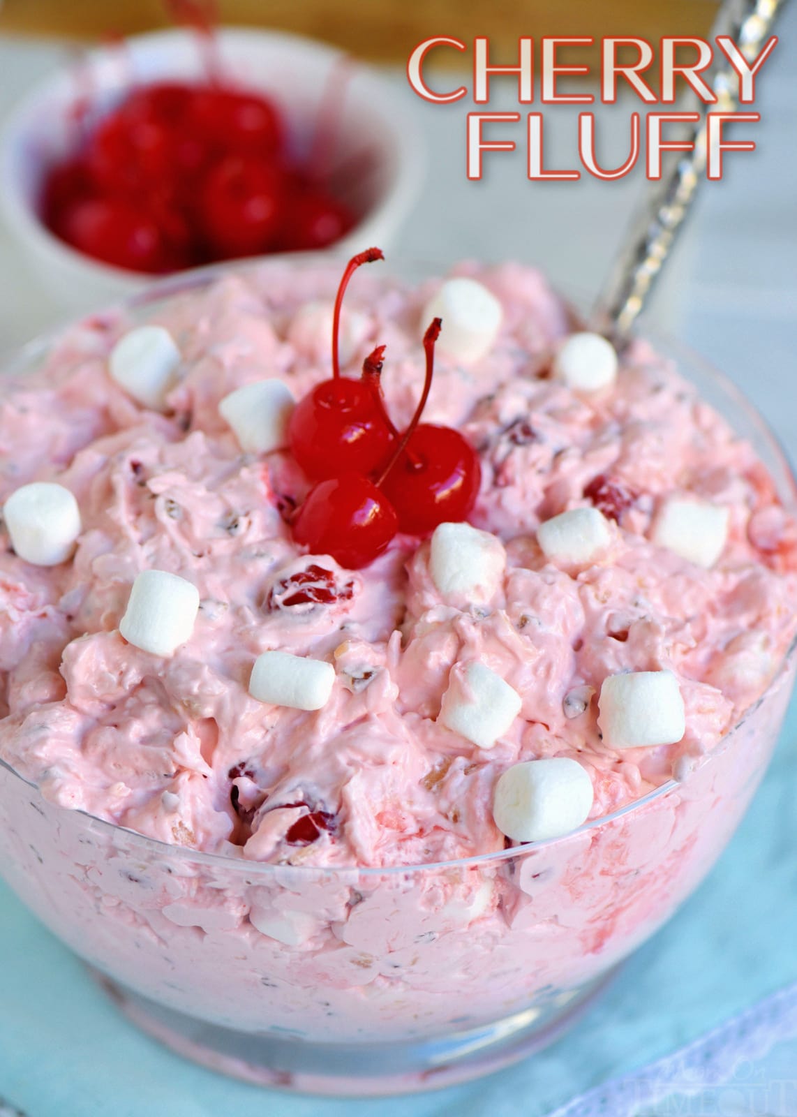 cherry fluff recipe in clear bowl with spoon AND title overlay