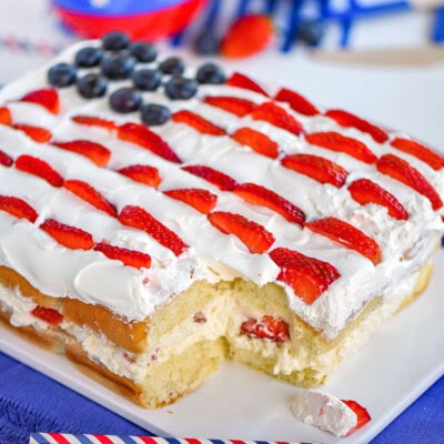 Flag decorated hawaiian roll dessert made with no bake cheesecake and fresh berries.
