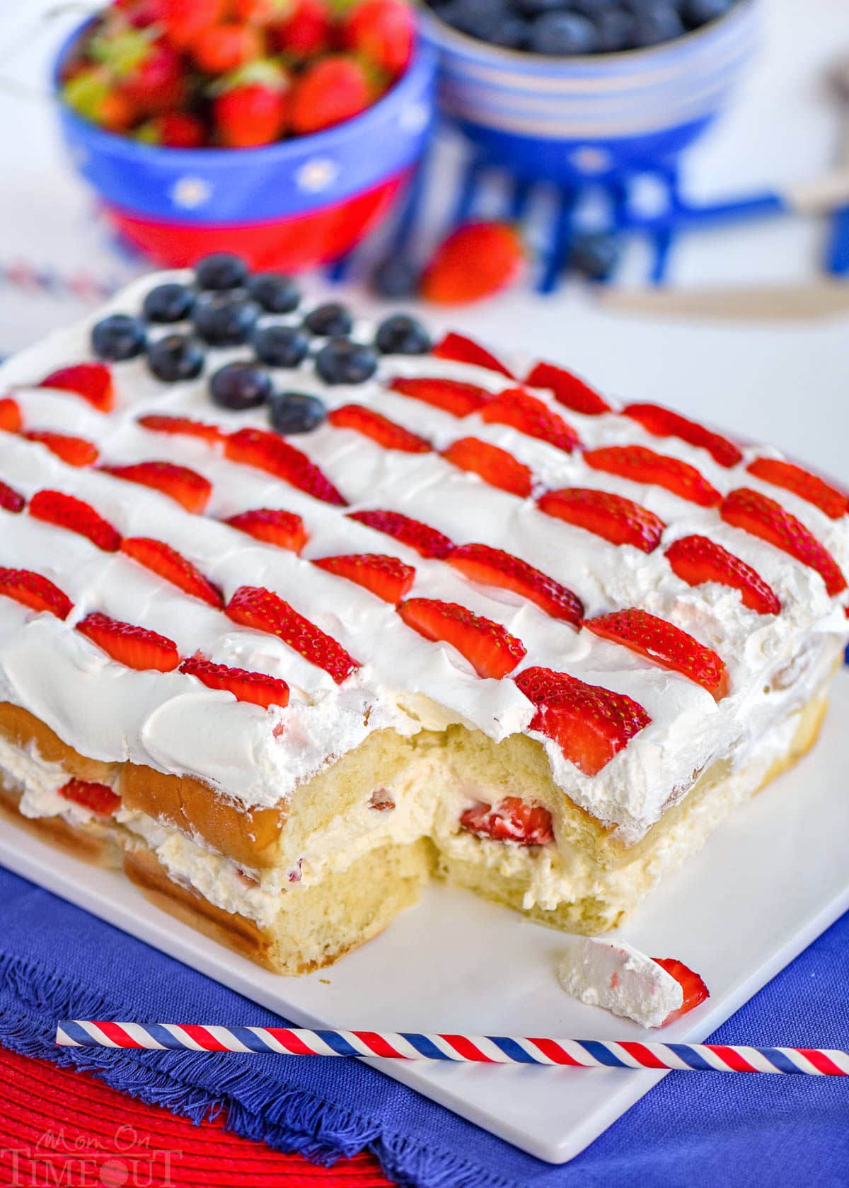 Flag decorated hawaiian roll dessert made with no bake cheesecake and fresh berries.