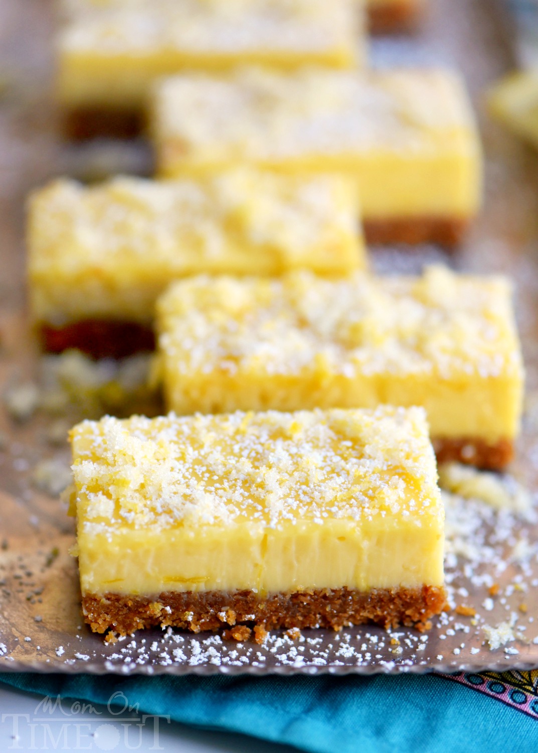 These Lemon Drop Bars are extra creamy and topped with candied lemon zest for the BIGGEST lemon flavor possible! So easy to make, deliciously sweet and tart, you'll find this treat hard to resist! // Mom On Timeout 