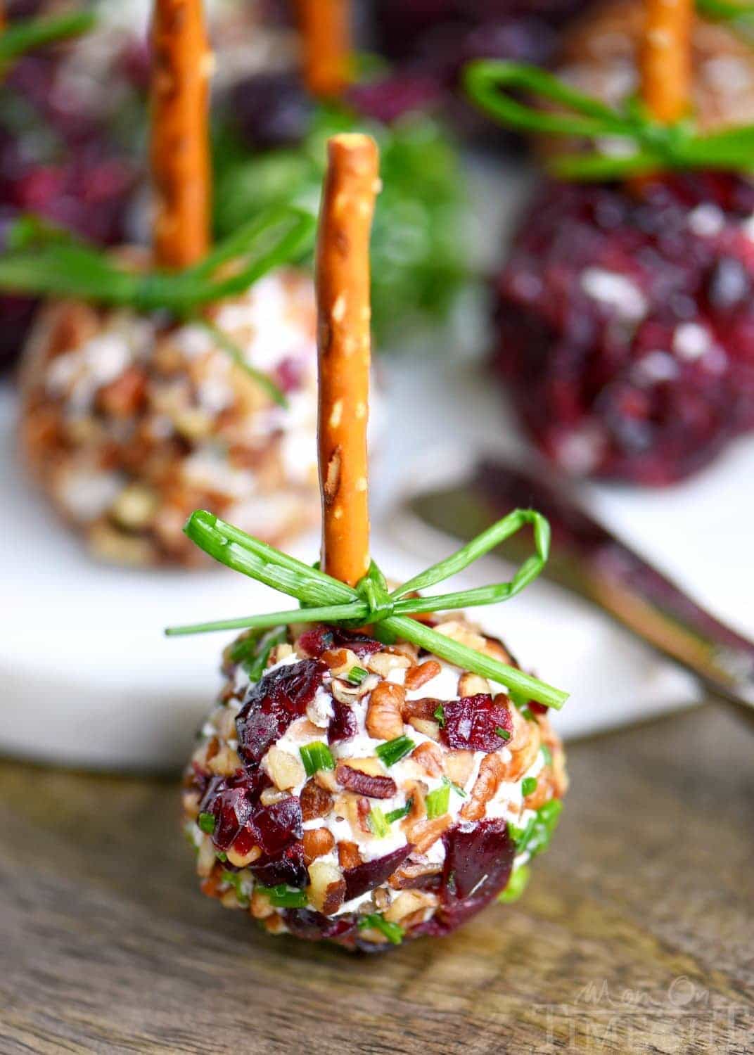 Cranberry Pecan Mini Goat Cheese Balls! Holiday entertaining has never been easier or more delicious! So easy to make and gorgeous too! Perfect for Thanksgiving, Christmas, and New Year's! (Can be made in advance!) // Mom On Timeout