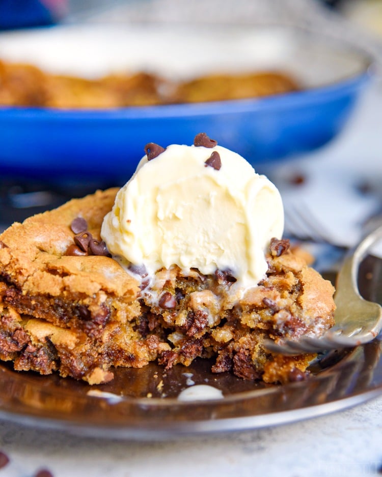 https://www.momontimeout.com/wp-content/uploads/2020/02/skillet-cookie-with-chocolate-chips-and-ice-cream-on-plate.jpg