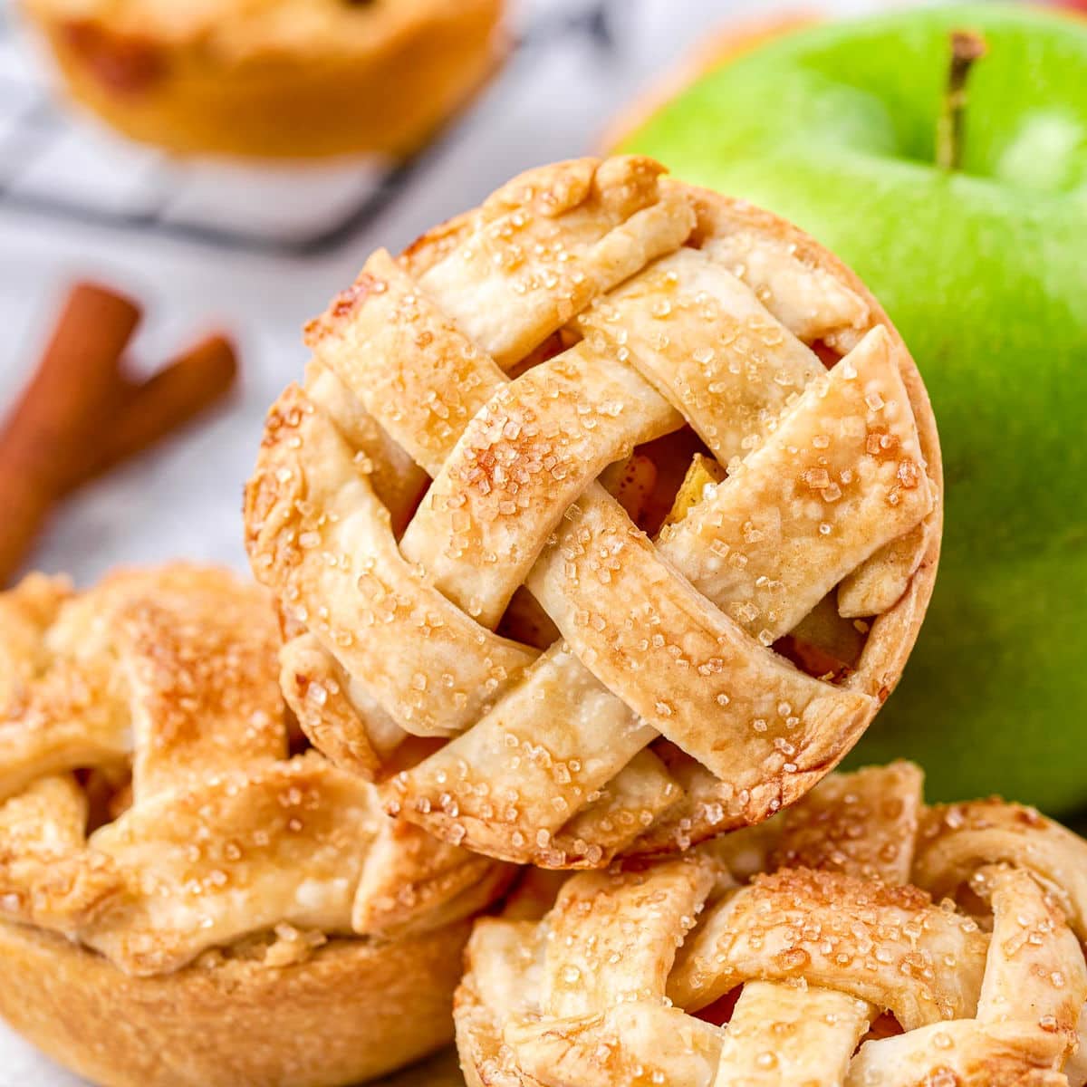 https://www.momontimeout.com/wp-content/uploads/2021/10/mini-apple-pies-recipe-square.jpeg