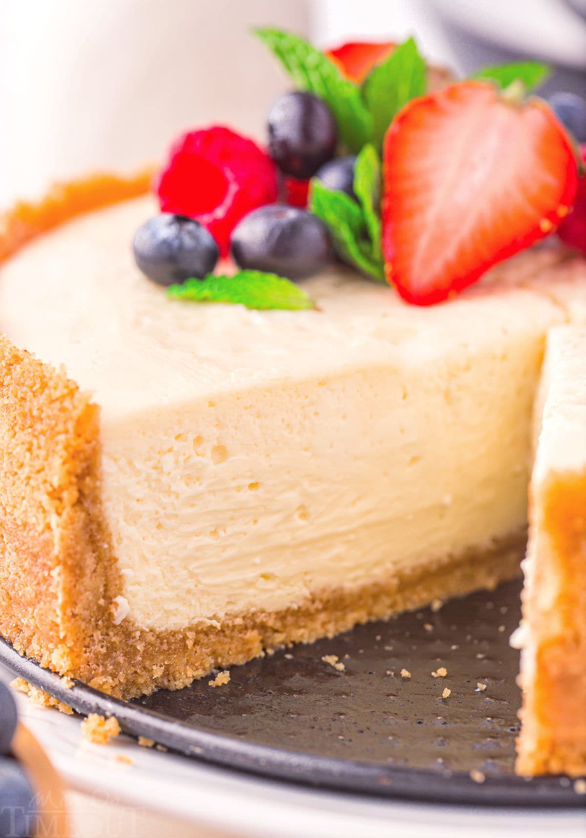 https://www.momontimeout.com/wp-content/uploads/2023/06/instant-pot-cheesecake-slice-removed.jpeg