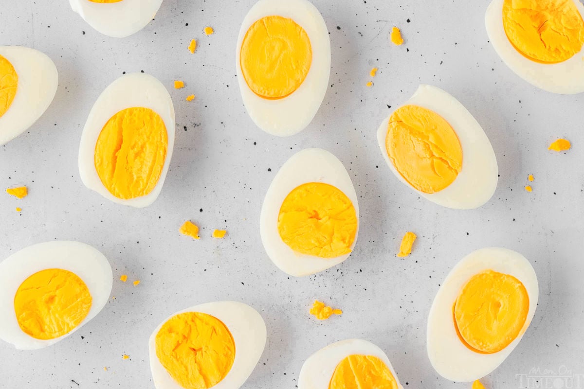 Hard boiled eggs on a light surface.