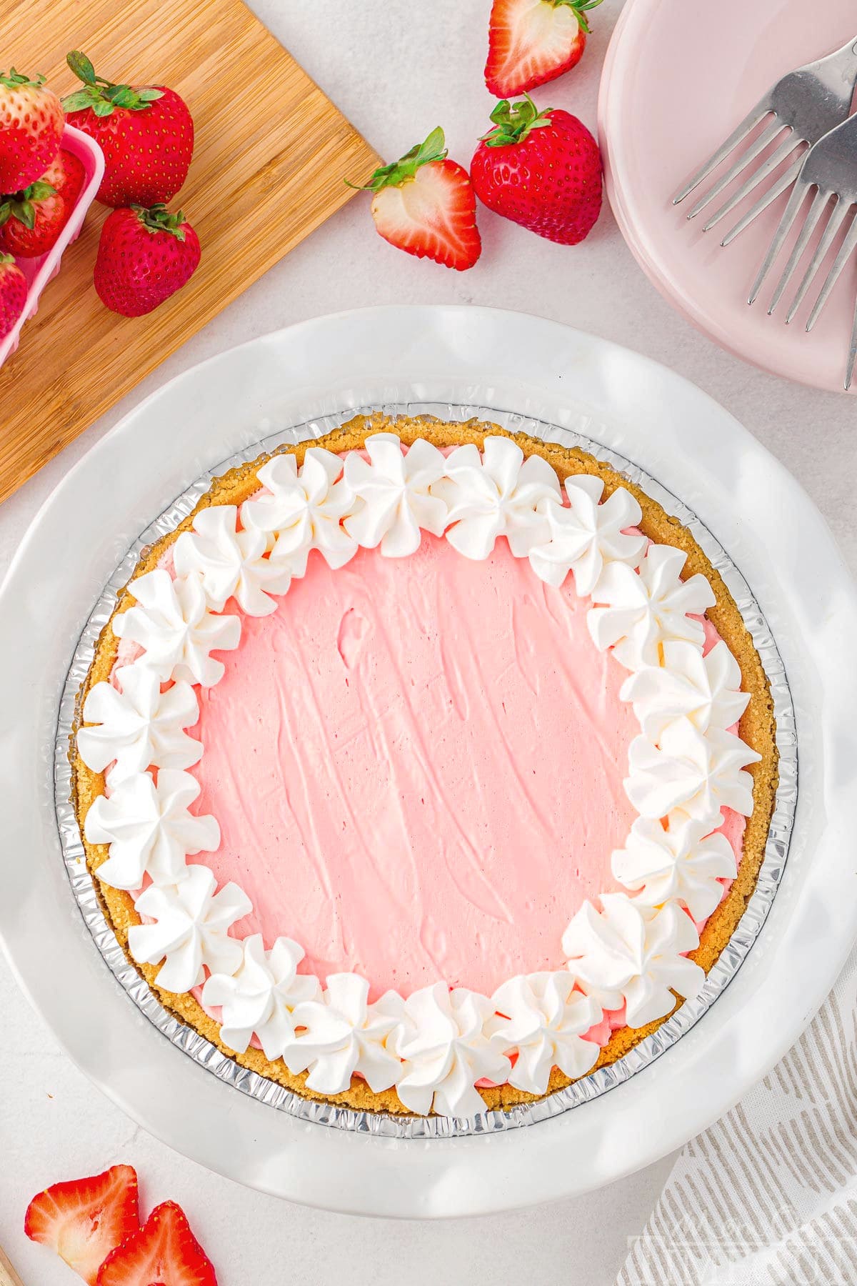 top down view of kool aid pie topped with whipped cream ready to be enjoyed.