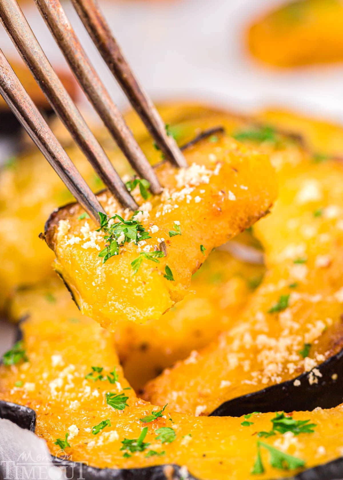 A fork picking up a piece of acorn squash.