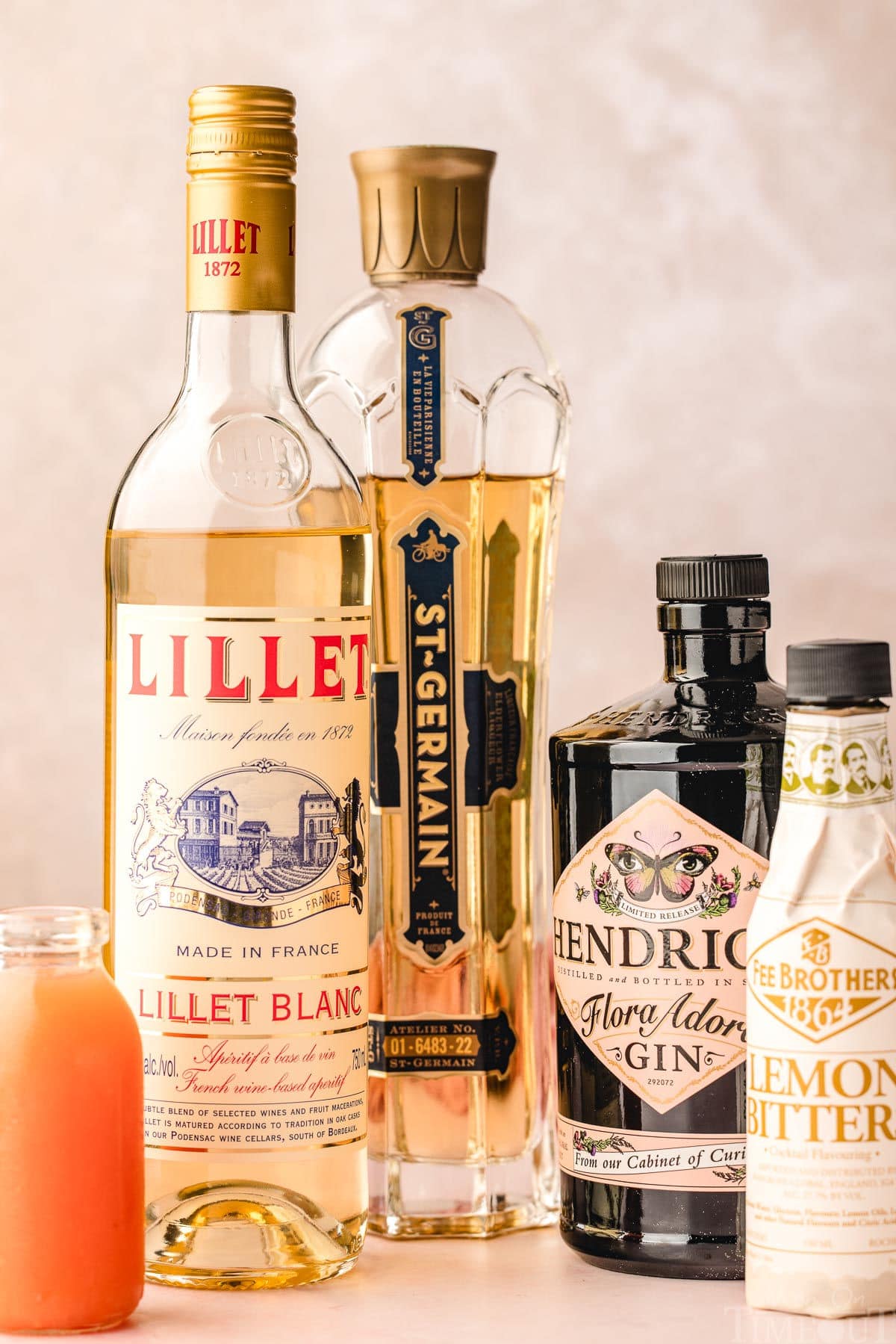 Image shows all the ingredients need to prepare a french blonde cocktail.