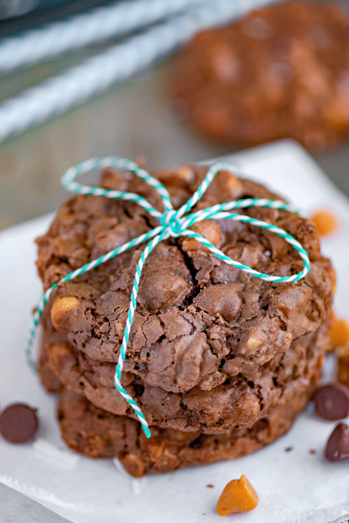 Brownie cookies in a stack tied with white and green twine.