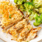 Longhorn Parmesan Crusted Chicken on a white plate next to a side of broccoli.