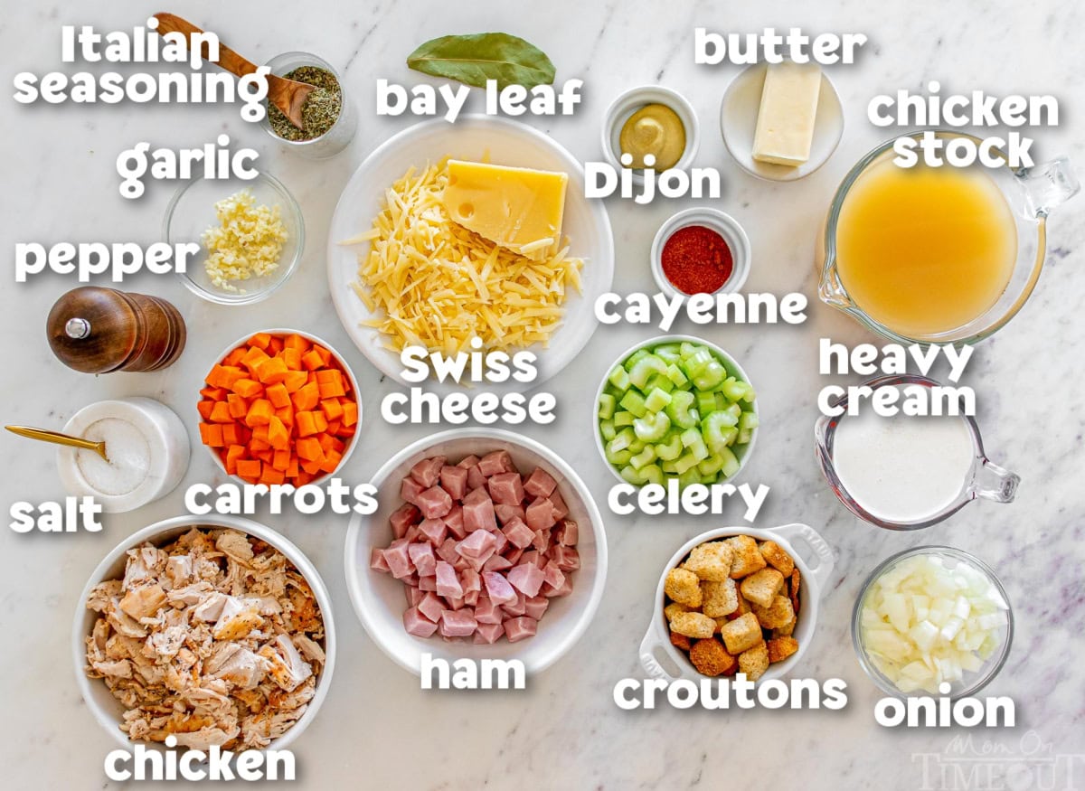 Labeled ingredients for chicken cordon bleu soup. The ingredients are in white bowls on a marble surface.