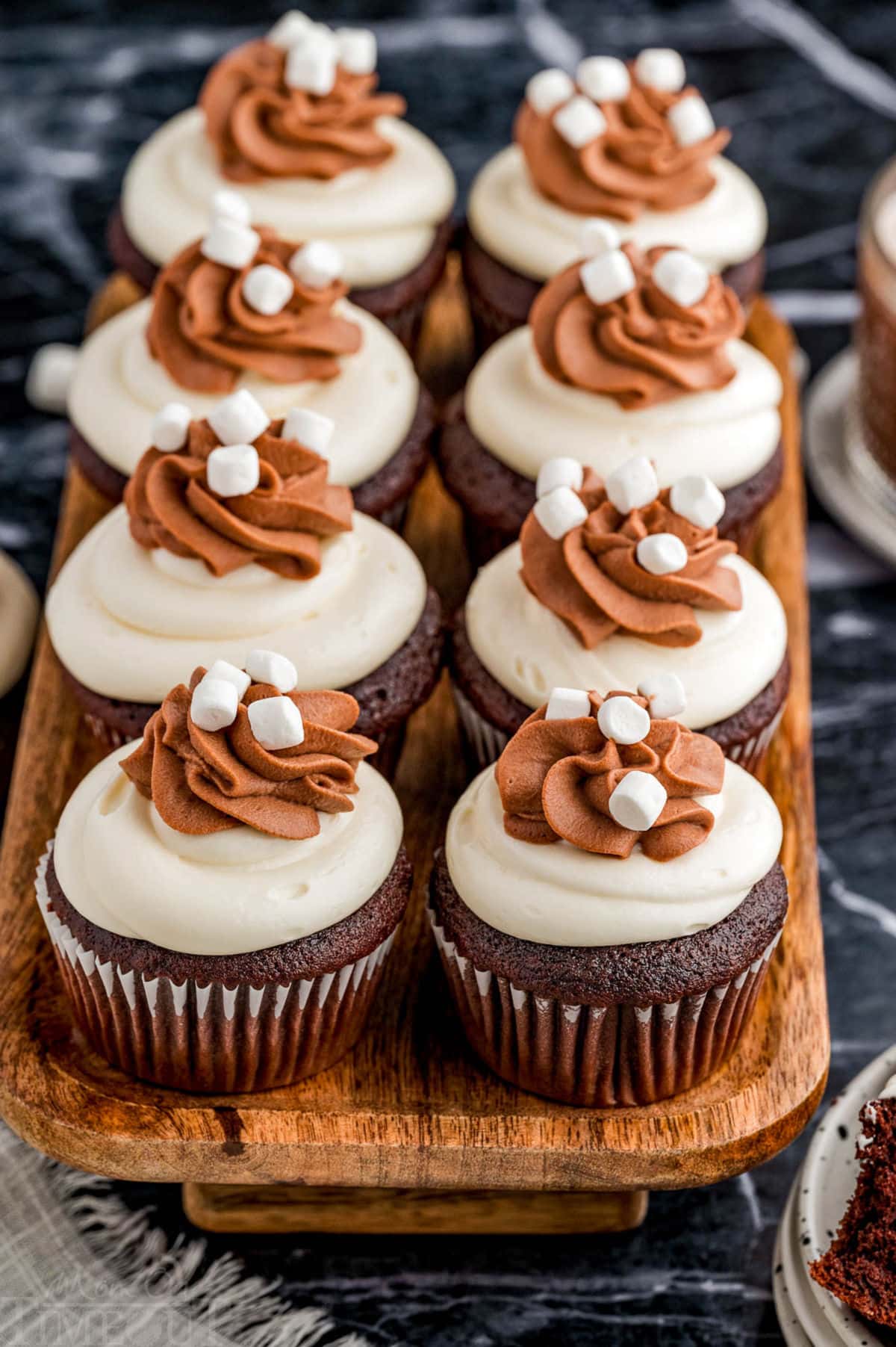 Hot chocolate cupcakes lined up on a serving tray.