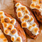 Close up shot of twice baked sweet potatoes on a piece of parchment paper.