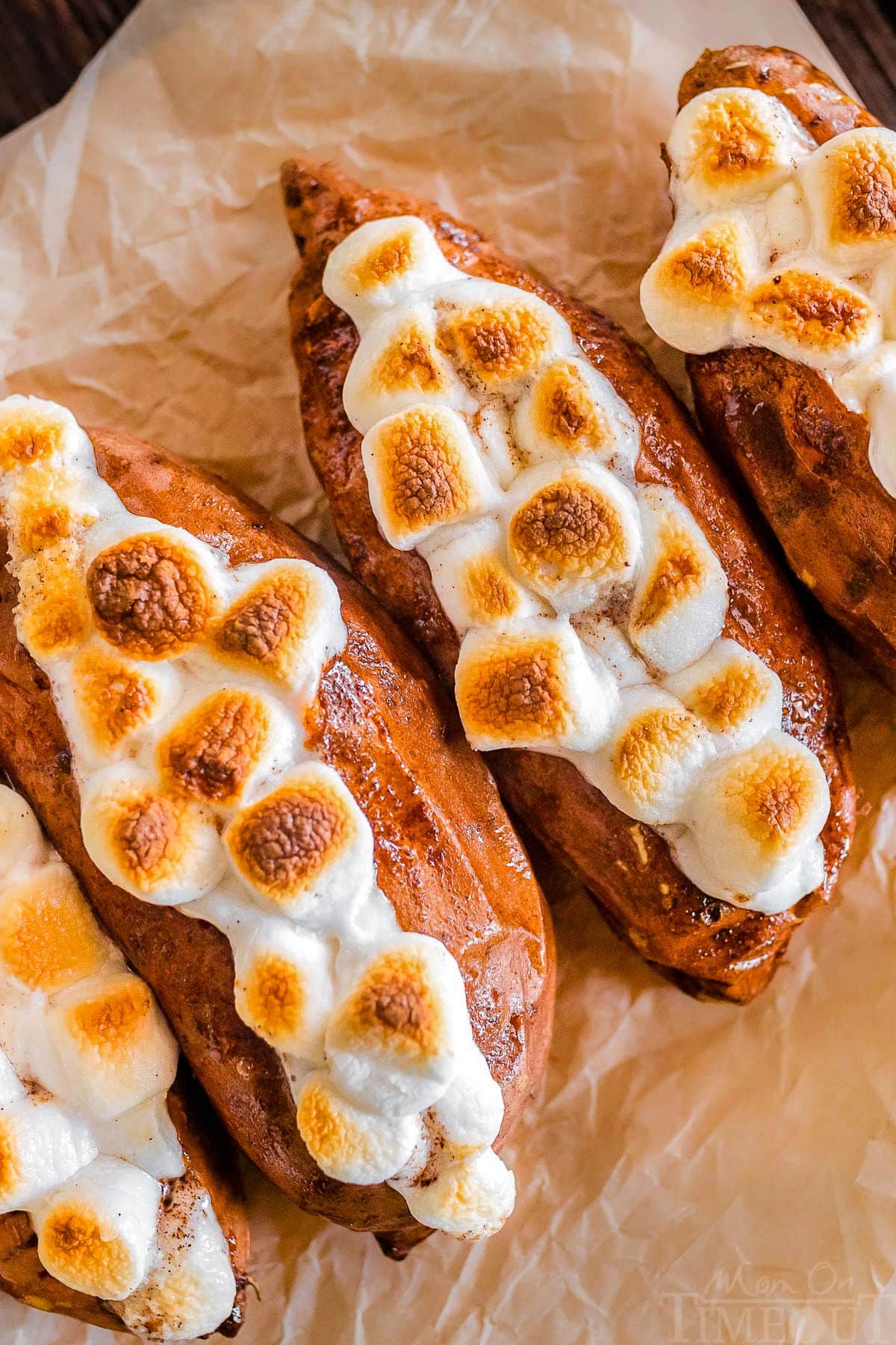 Close up shot of twice baked sweet potatoes on a piece of parchment paper.