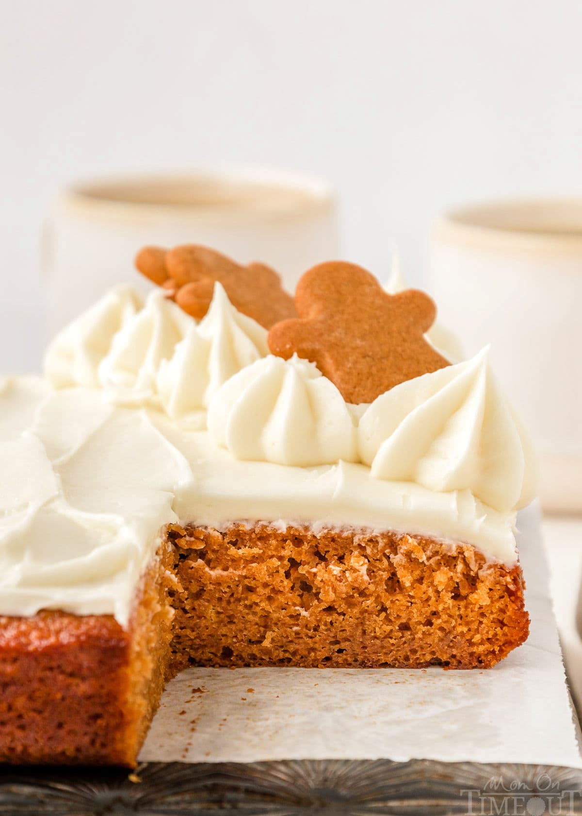 A side view of gingerbread cake with a slice taken out of it. You can see the texture of the cake.