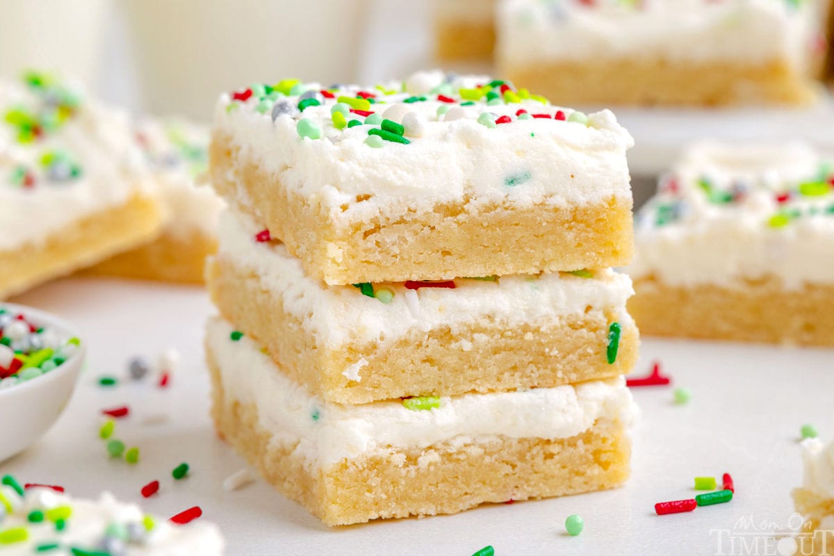 3 Christmas Sugar Cookie Bars in a stack. Extra bars are in the background.