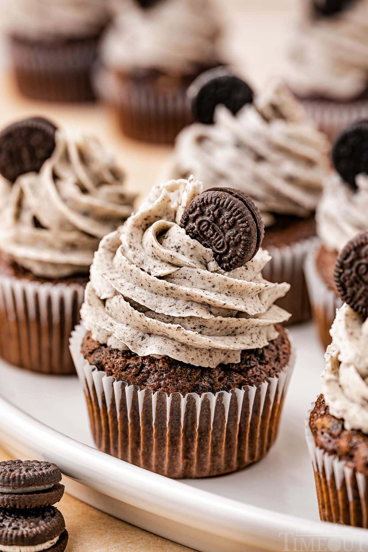 Oreo Cupcakes on a white serving plate.