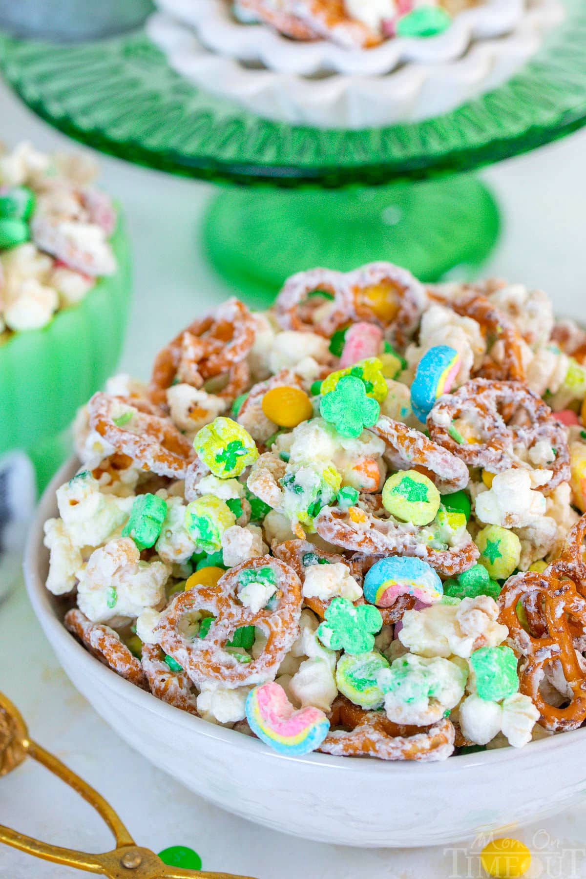 Close up look at Leprechaun Bait in white bowl with green cake stand in background.