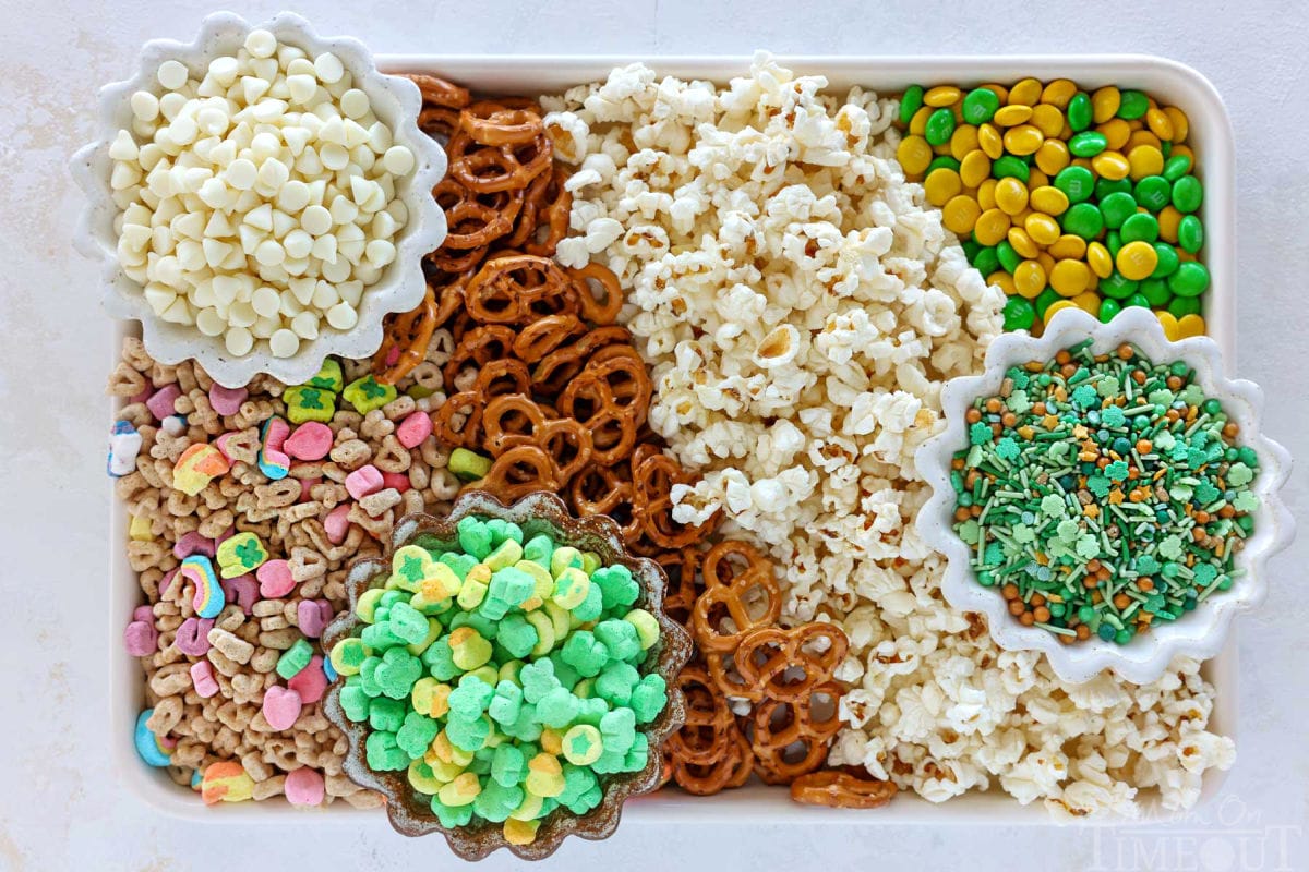 Ingredients for leprechaun bait recipe on sheet tray organized into rows.